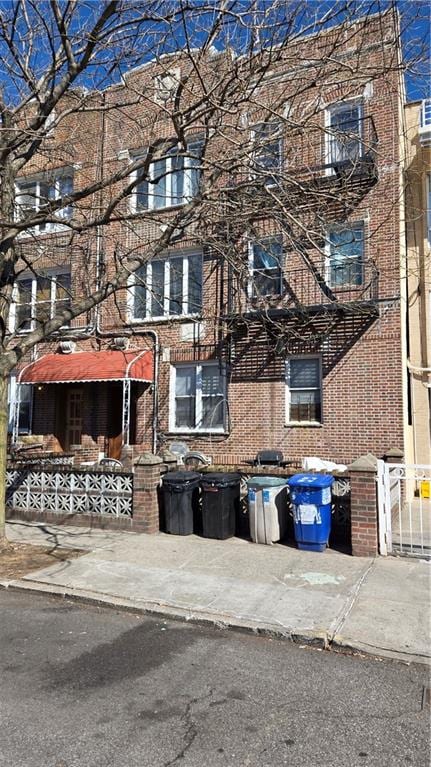 view of front of home featuring brick siding