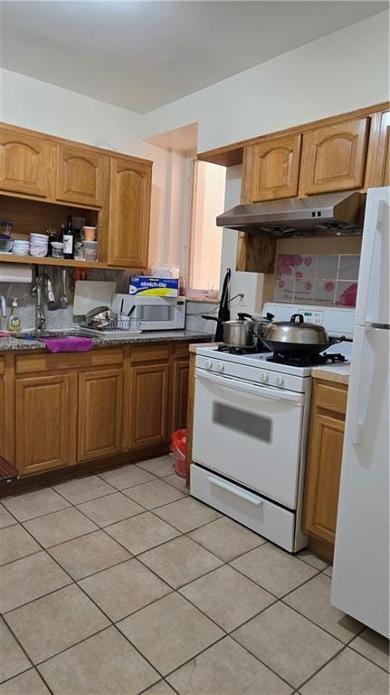 kitchen featuring brown cabinets, white appliances, under cabinet range hood, and open shelves