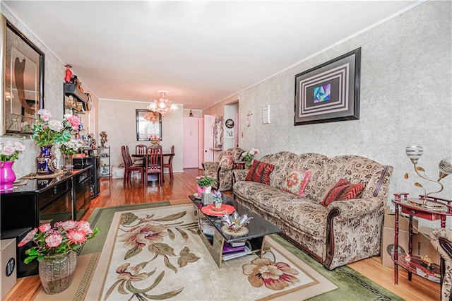 living room with a notable chandelier and wood finished floors