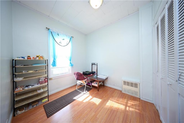 interior space with light wood-type flooring, baseboards, and visible vents