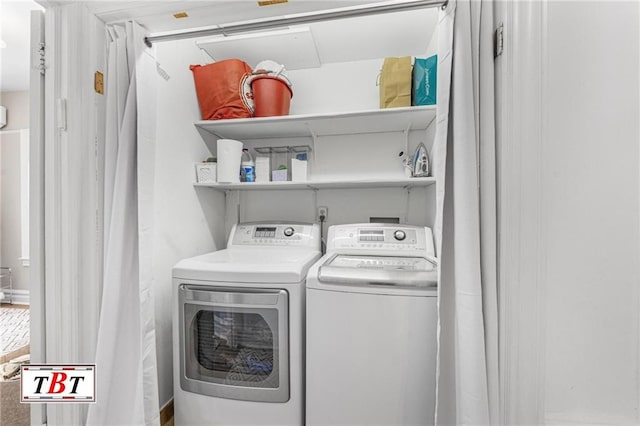 washroom featuring laundry area and washer and clothes dryer