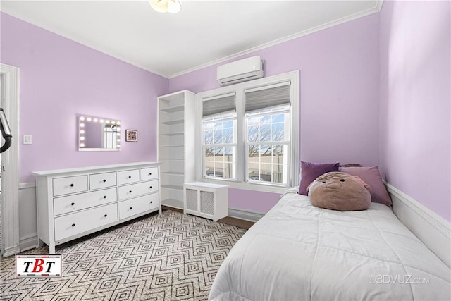 bedroom with a wall mounted AC, ornamental molding, and baseboards