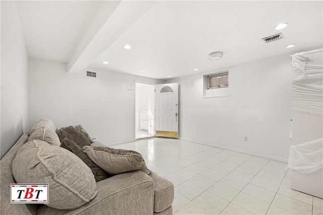 living area featuring recessed lighting, light tile patterned floors, and baseboards