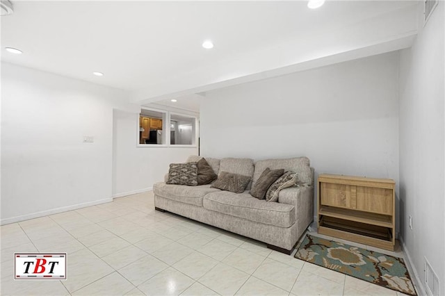 living area with recessed lighting, light tile patterned flooring, and baseboards