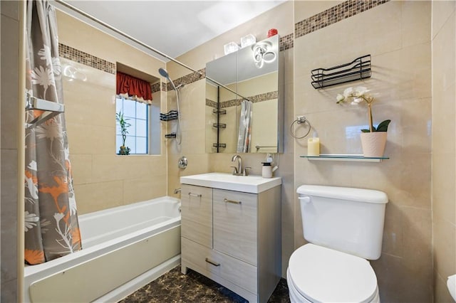 bathroom featuring toilet, shower / bathtub combination with curtain, tile walls, and vanity