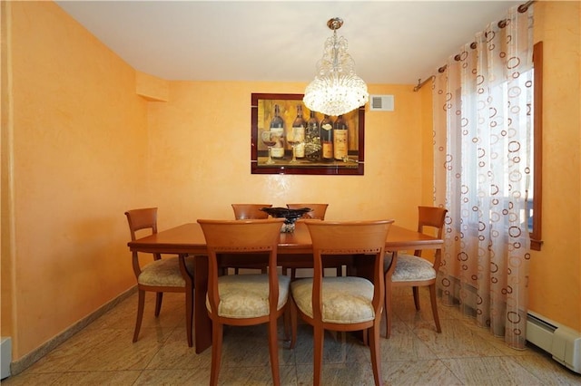 dining space with an inviting chandelier, baseboards, and a baseboard heating unit