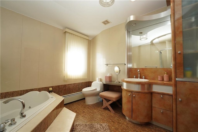 bathroom featuring toilet, vanity, visible vents, baseboard heating, and a bath