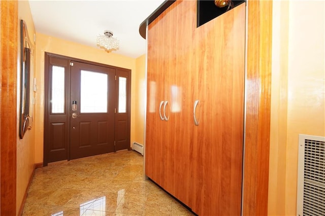 interior space featuring a baseboard radiator, visible vents, and granite finish floor