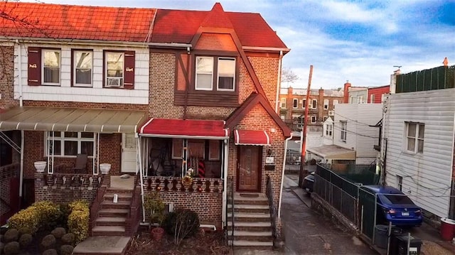 multi unit property with cooling unit and brick siding