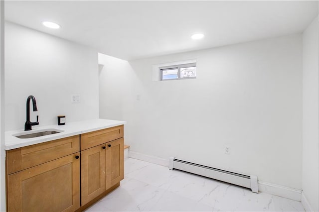 bathroom with marble finish floor, recessed lighting, a baseboard radiator, and baseboards