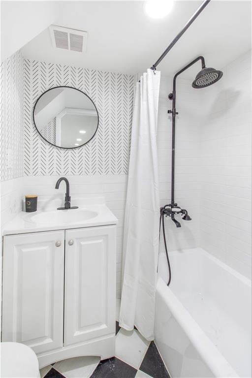 full bath featuring shower / bath combination with curtain, visible vents, vanity, and toilet