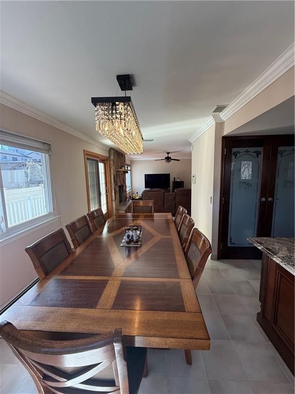 dining room featuring ceiling fan and ornamental molding