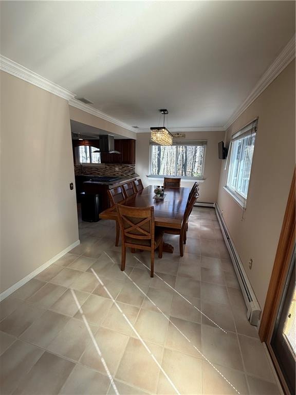 dining space featuring light tile patterned floors, baseboards, visible vents, ornamental molding, and baseboard heating