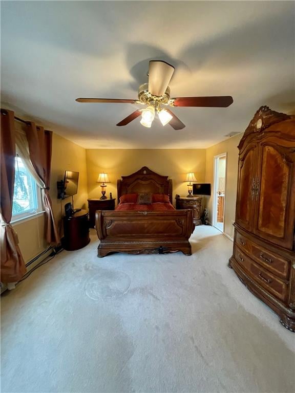 bedroom with a ceiling fan and light colored carpet