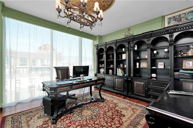 office featuring an inviting chandelier and dark wood-style floors