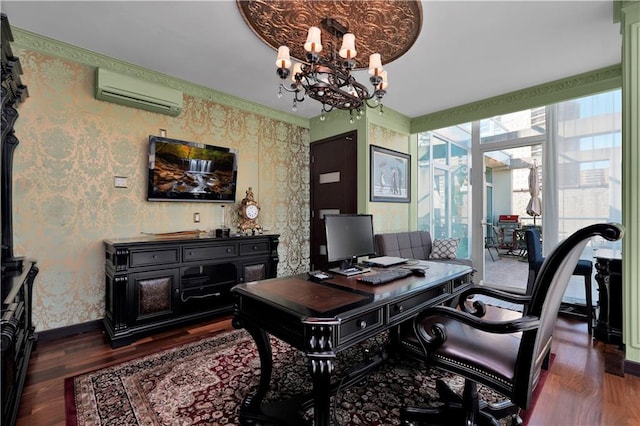 office space featuring baseboards, wallpapered walls, dark wood-style flooring, an AC wall unit, and a chandelier