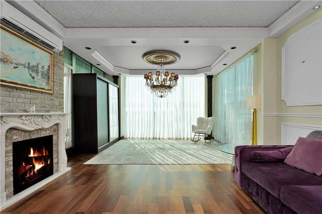 384 Neptune Ave Unit 601, Brooklyn, NY 11235 - interior space with wood finished floors, a tray ceiling, a wall mounted AC, and a notable chandelier