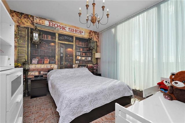 bedroom with a notable chandelier