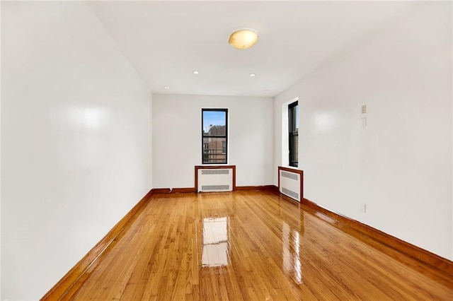 260 Ocean Pkwy Unit 6D, Brooklyn, NY 11218 - unfurnished room with radiator, light wood-type flooring, baseboards, heating unit, and recessed lighting