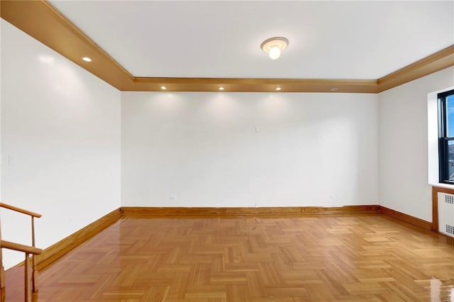 empty room with recessed lighting, radiator, and baseboards