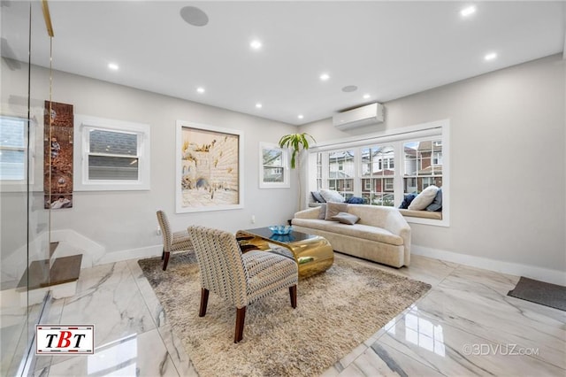 living area featuring baseboards, marble finish floor, a wall unit AC, and recessed lighting