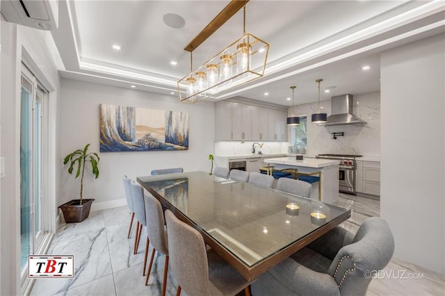 dining room featuring recessed lighting, baseboards, marble finish floor, a tray ceiling, and a wall mounted air conditioner