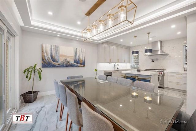 dining area featuring marble finish floor, baseboards, a tray ceiling, and recessed lighting