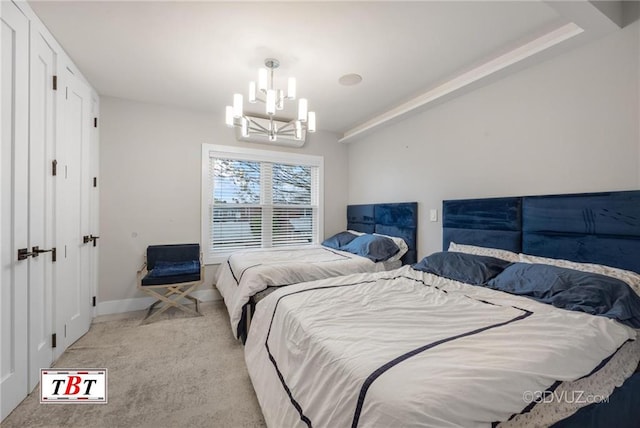 bedroom featuring light colored carpet, a notable chandelier, and baseboards