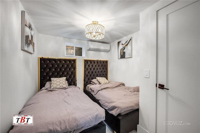 bedroom with a notable chandelier and an AC wall unit