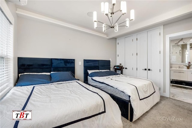 bedroom featuring light colored carpet, connected bathroom, and an inviting chandelier