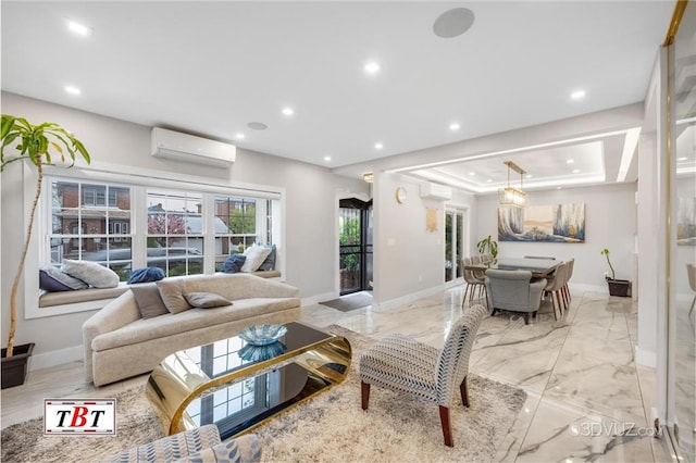 living area featuring baseboards, a raised ceiling, marble finish floor, an AC wall unit, and recessed lighting