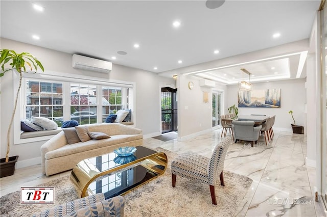 living room featuring baseboards, marble finish floor, a tray ceiling, an AC wall unit, and recessed lighting