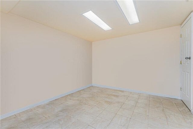 empty room with baseboards