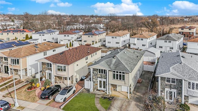 birds eye view of property with a residential view