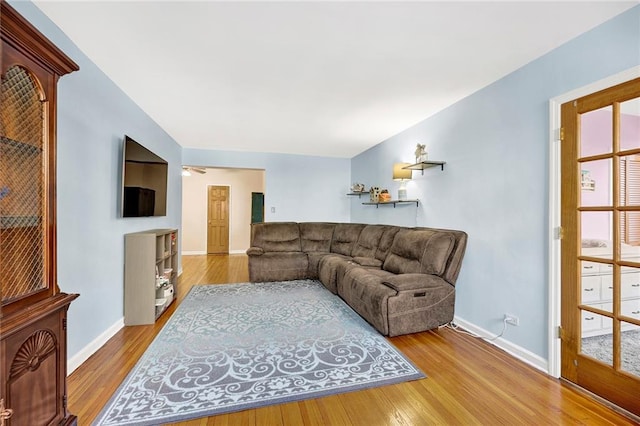 living area with baseboards and light wood-style floors