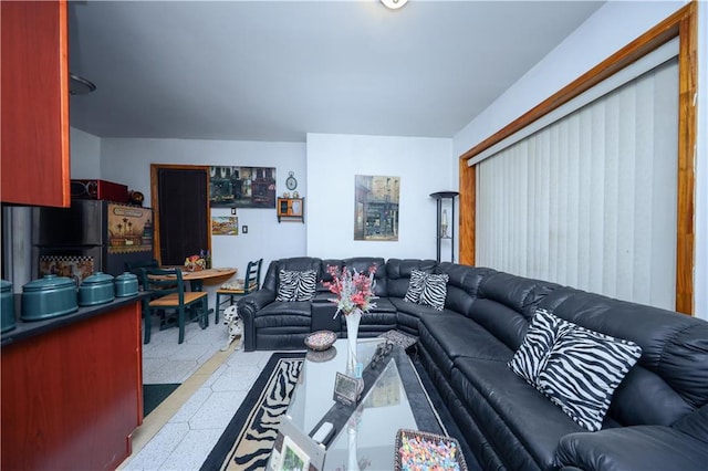 living area featuring tile patterned floors