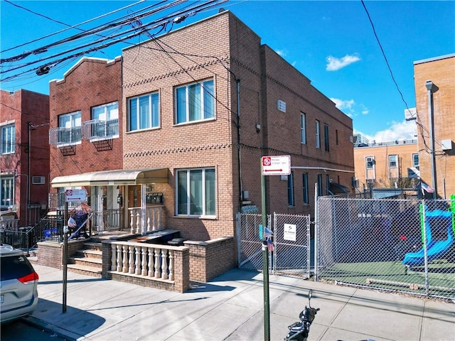 view of building exterior featuring fence