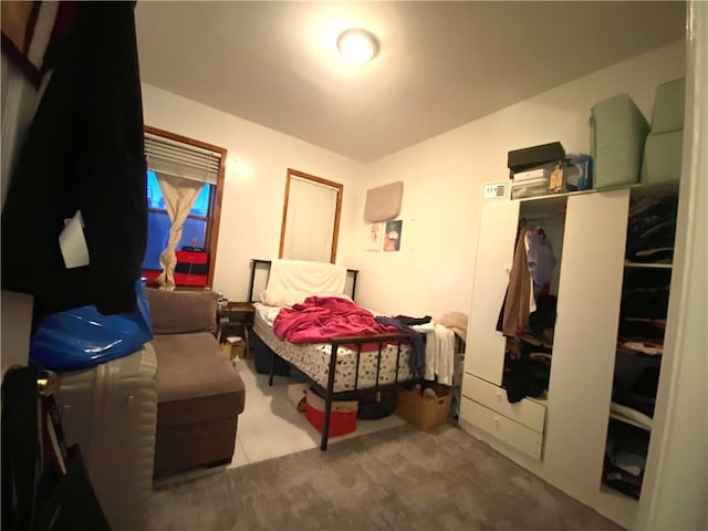 carpeted bedroom with a closet