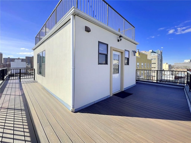 wooden deck with a city view