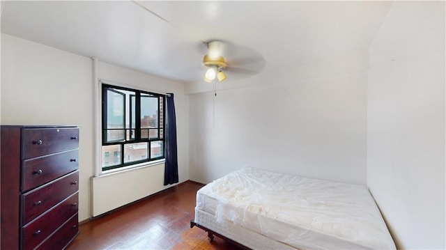 bedroom featuring ceiling fan and wood finished floors