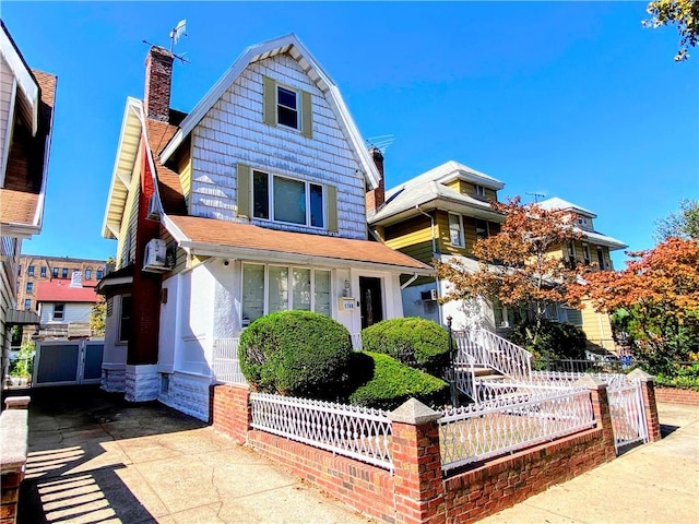 view of front of house with fence and a chimney