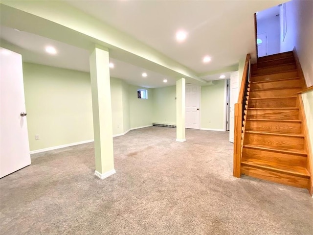 finished basement featuring recessed lighting, carpet floors, baseboards, stairway, and baseboard heating