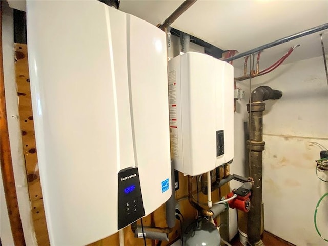 utility room featuring water heater