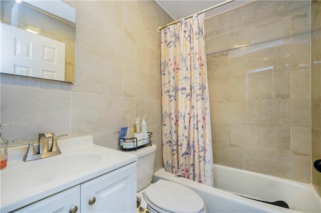 bathroom with toilet, shower / bath combo, tile walls, decorative backsplash, and vanity