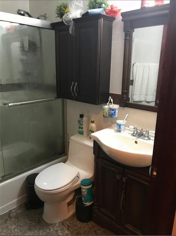947 55th St Unit 4B, Brooklyn, NY 11219 - full bathroom with vanity, toilet, and combined bath / shower with glass door
