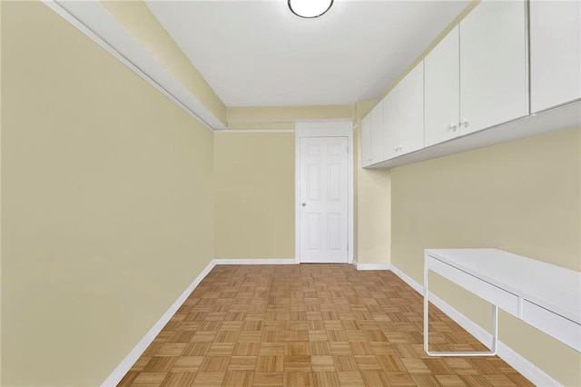 interior space featuring baseboards