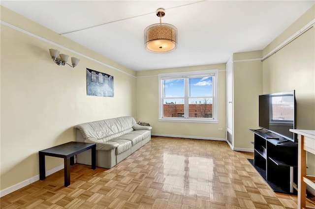 living room featuring baseboards