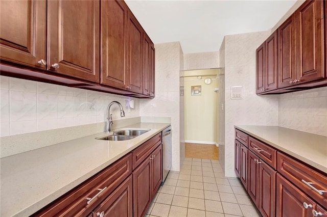 kitchen with dishwasher, light tile patterned floors, decorative backsplash, and a sink