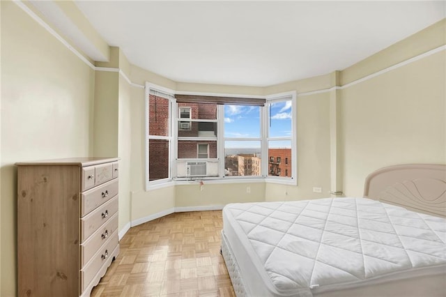 bedroom with cooling unit and baseboards