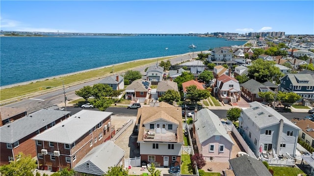 birds eye view of property with a residential view and a water view